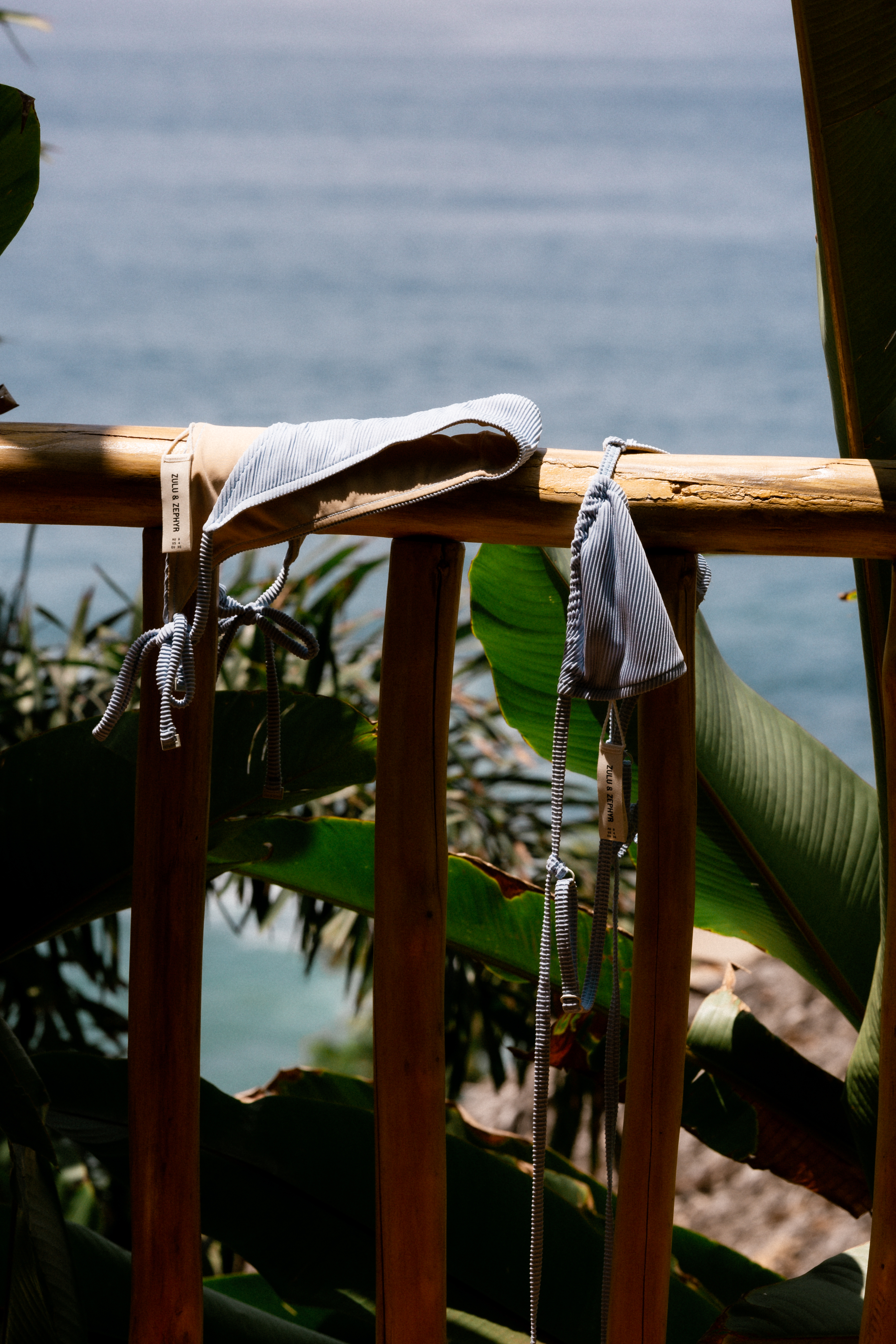 Bungalow terrace railing with tropical garden and ocean view