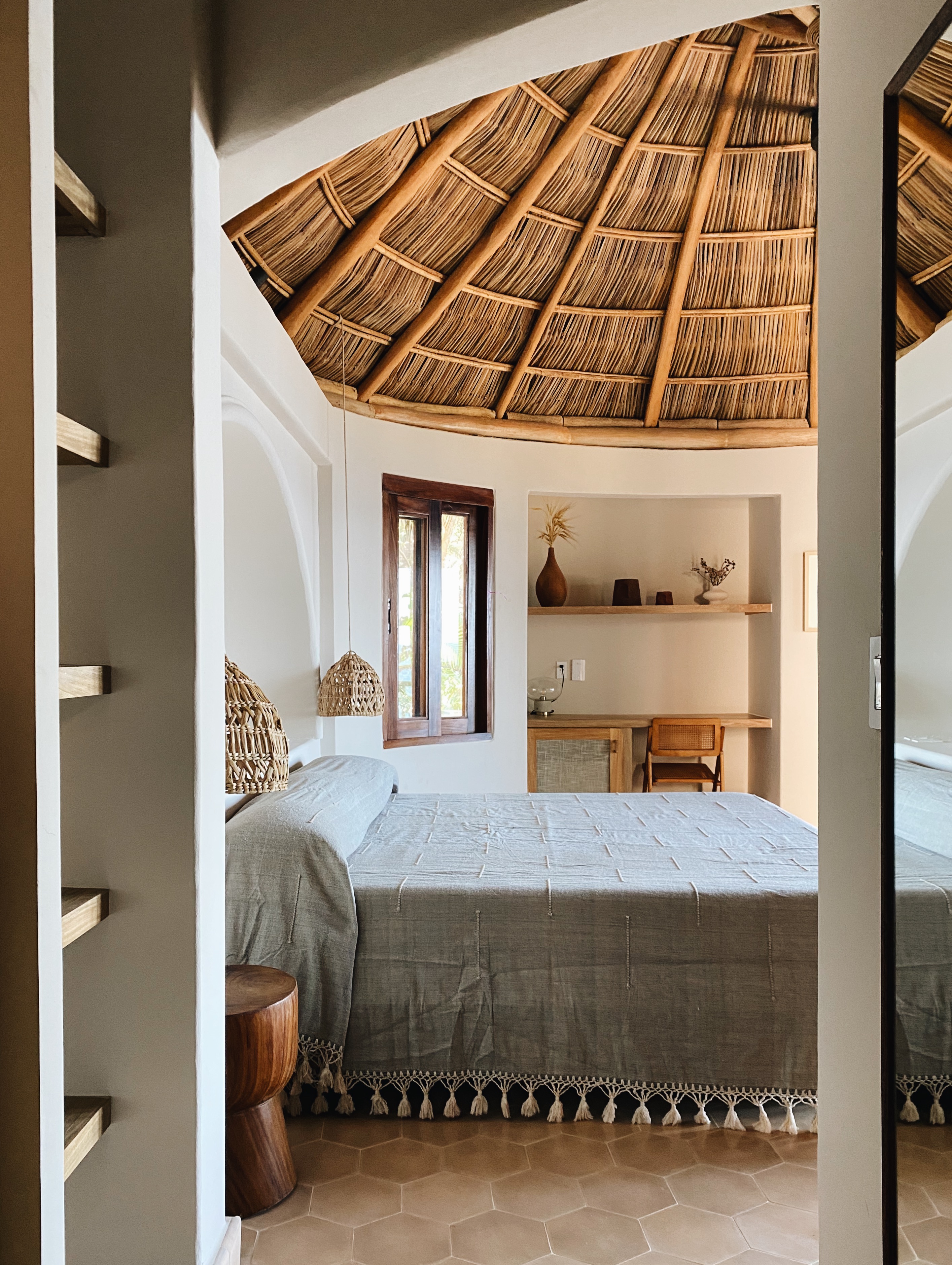 Deluxe King Bungalow interior with thatched ceiling