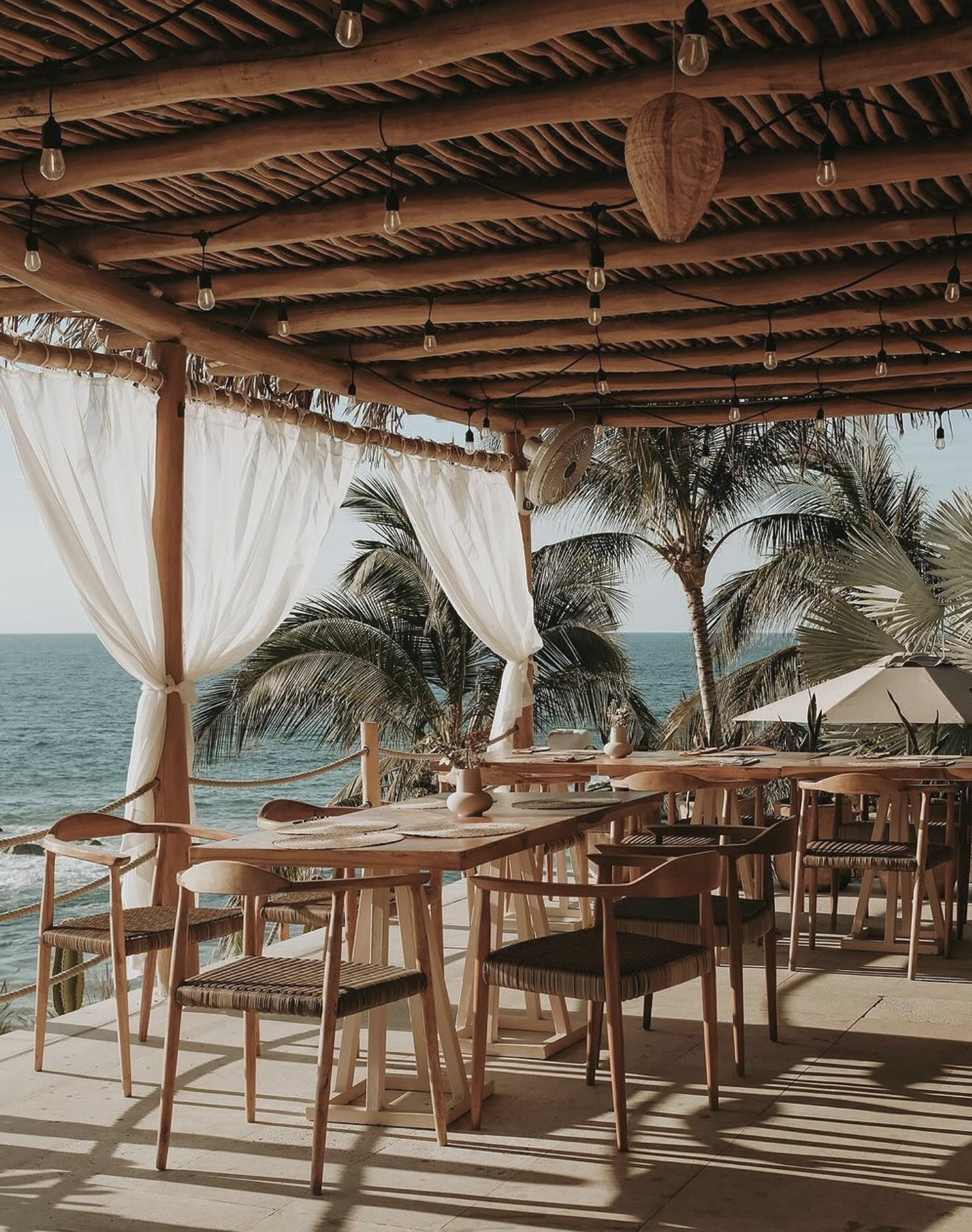 Open-air dining with ocean view at Tekuamana