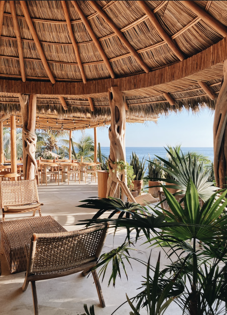 Tekuamana restaurant at La Joya Sayulita with thatched ceiling and ocean view
